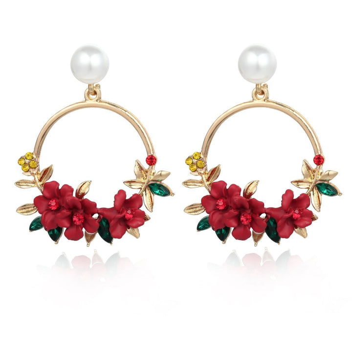 Elegante Goldohrringe mit Blumen und Perlen